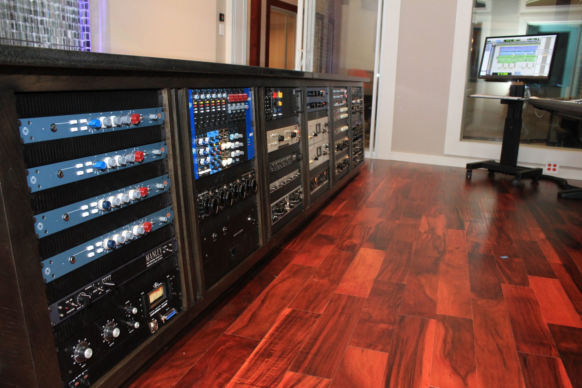 Studio outboard rack of preamps and processors integrated with a Pro Tools system